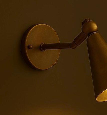 Matte bronze cone wall lamp with pivot joint