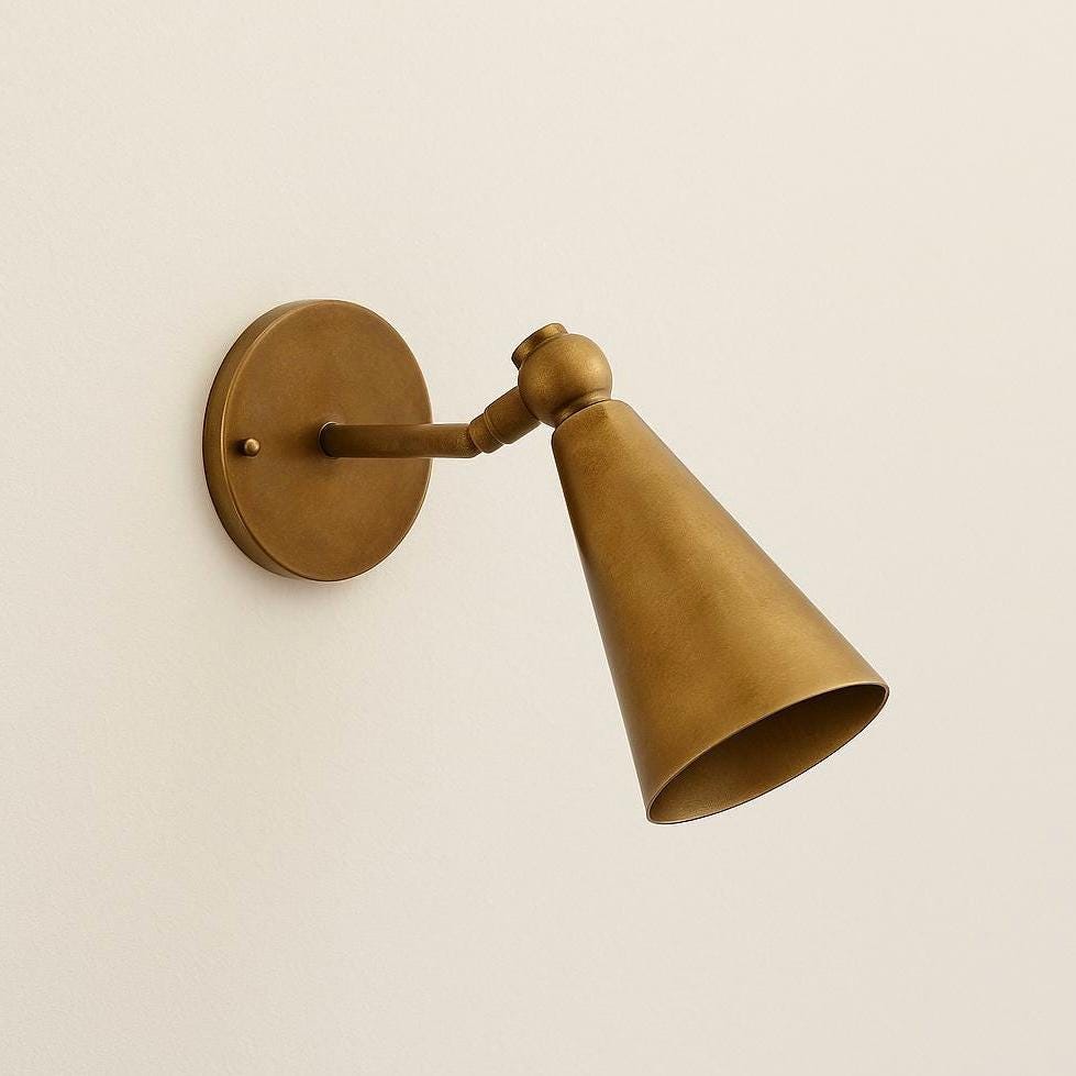 Brushed brass cone sconce with circular wall plate