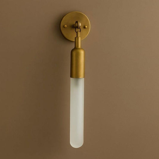 Brass wall sconce with frosted glass tube