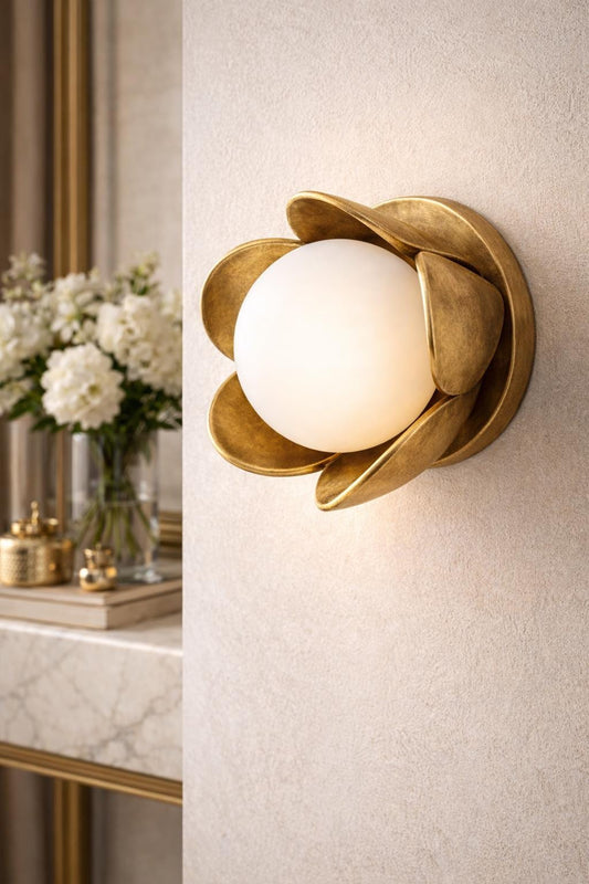 Handmade floral brass wall sconce with frosted glass globe